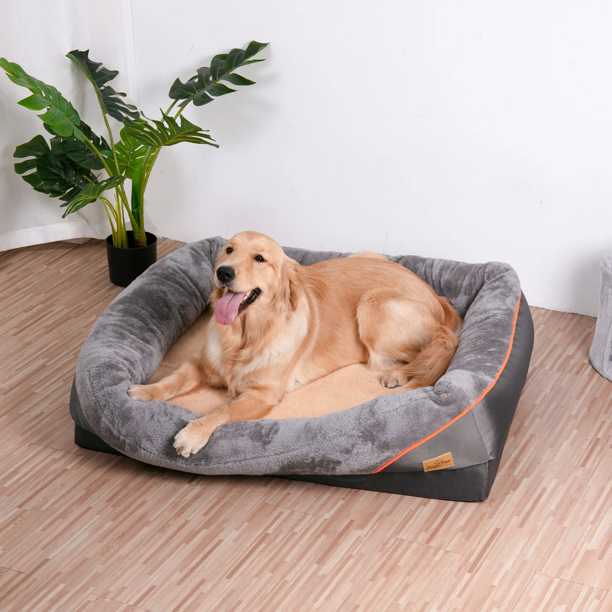 Grey bolstered orthopedic dog bed with memory foam base