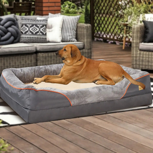 Large dog resting against the quilted bolster